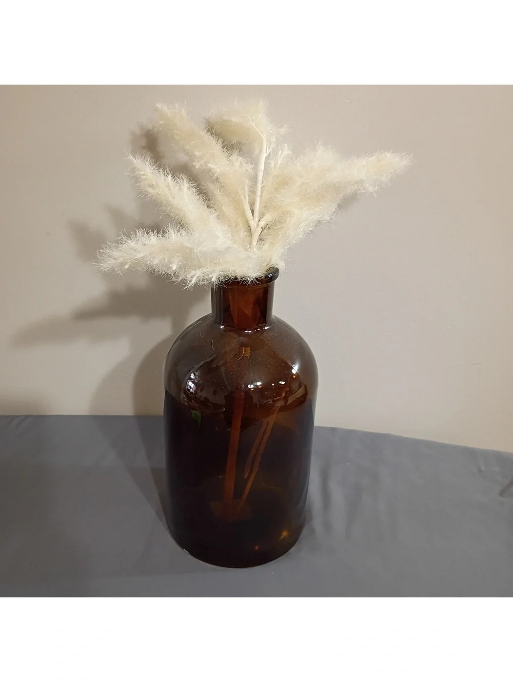 Amber Glass Bottle Vase with Decorative Pampas Grass